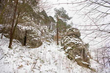 winter landscape with snow-covered rocks. Mountains in winter on a cloudy dayの写真素材