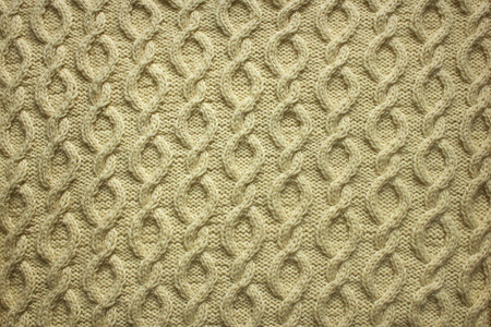 white background knitted fabric with arana pattern close-up