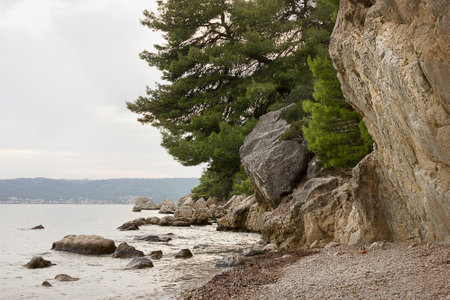 A rocky shore on the Adriatic Sea. Landscape with sea and mountainsの写真素材