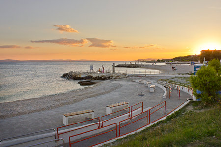 Sunset on the Adriatic Sea. Beach for people with disabilities in Split, Croatia.の写真素材