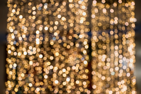 Gold blurred background with bokeh. Close-up of sparkling lights