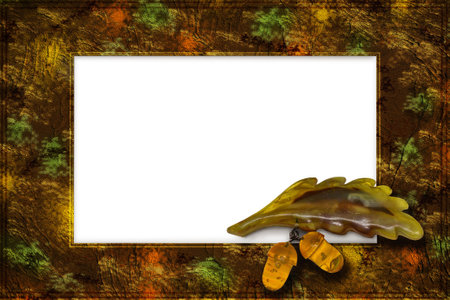 Brown frame with yellow streaks and amber decoration. Amber oak leaf with acornsの写真素材