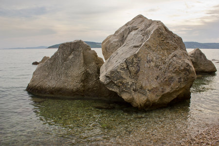Landscape with large boulders in the sea. Sea beach with picturesque stones.の写真素材