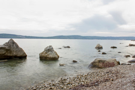 Landscape with large boulders in the sea. Sea beach with picturesque stones.の写真素材