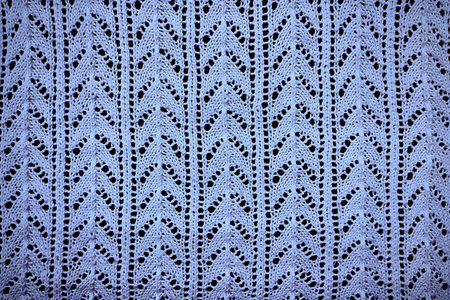 Textile background blue openwork knitted fabric close-upの写真素材