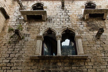 Close-up of the wall of an old house with beautiful windows. Ancient architecture of Split, Croatia.の写真素材