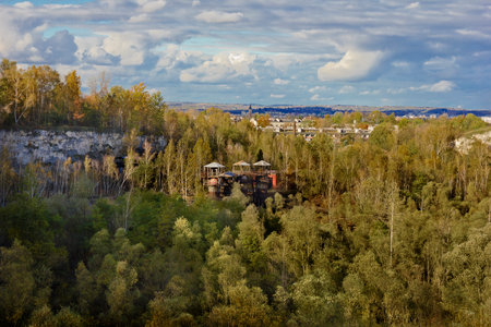 landscape autumn forest in a quarry under a cloudy skyの写真素材