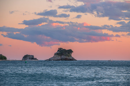 Pink sunset on the Adriatic Sea. Landscape with an island