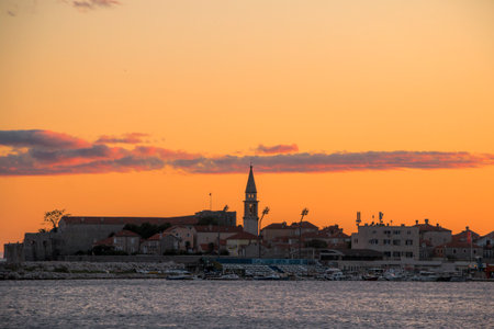 Orange sunset over the sea. Citadel on the shore of the Adriatic Sea. The ancient 15th century St. Mary's Fortress.の写真素材