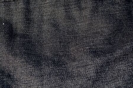 Grunge abstract background, texture of old  grey textile jeans surfaceの写真素材
