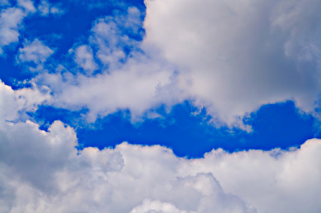 Blue summer sky on a sunny day and white cumulus clouds