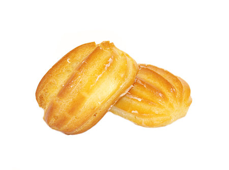 Two appetizing sweet cakes eclairs with cream  isolated on white background