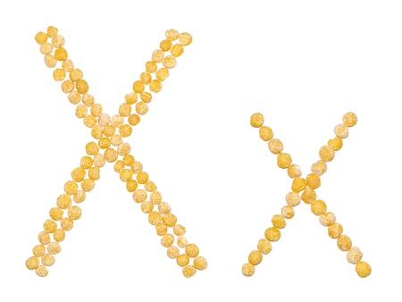 Edible alphabet: uppercase and lowercase letter "X" of dry orange peas isolated on white backgroundの写真素材