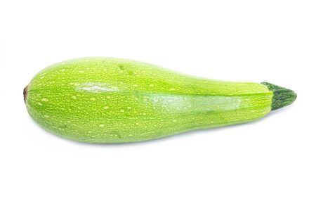 One bright green raw washed squash marrow zucchini isolated on white backgroundの写真素材