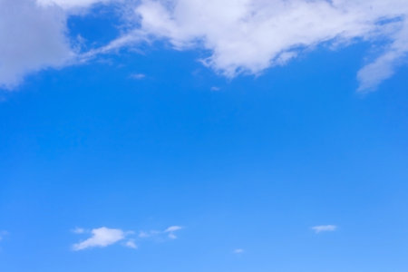Beautiful blue sky with few clouds on bright  sunny dayの写真素材