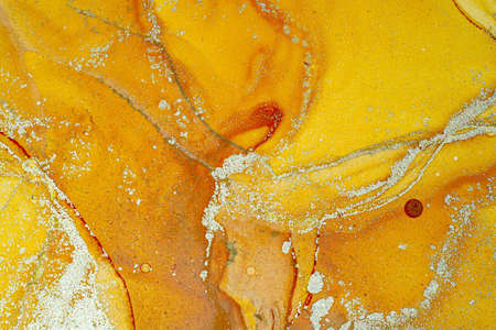 Abstract bright shiny color fluid background, hand drawn alcohol painting with golden streaks....