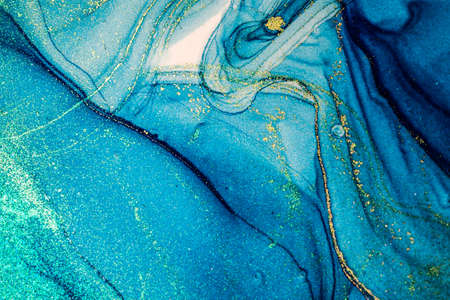 Abstract bright shiny color fluid background, hand drawn alcohol painting with golden streaks. Liquid ink technique texture for high resolution backdrop designの写真素材