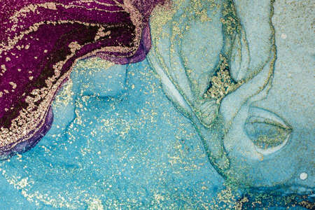 Abstract bright shiny color fluid background, hand drawn alcohol painting with golden streaks. Liquid ink technique texture for high resolution backdrop designの写真素材
