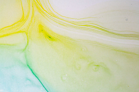 Abstract bright shiny color fluid background, hand drawn alcohol painting with golden streaks....