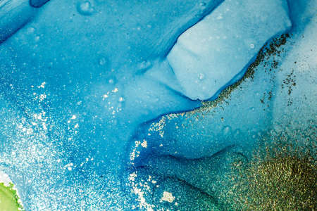 Abstract bright shiny color fluid background, hand drawn alcohol painting with golden streaks. Liquid ink technique texture for high resolution backdrop designの写真素材