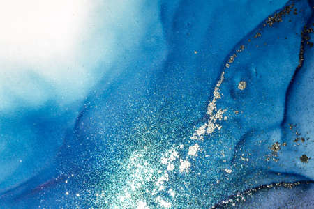 Abstract bright shiny color fluid background, hand drawn alcohol painting with golden streaks. Liquid ink technique texture for high resolution backdrop designの写真素材