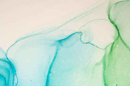 Abstract bright shiny color fluid background, hand drawn alcohol painting with golden streaks. Liquid ink technique texture for high resolution backdrop designの写真素材