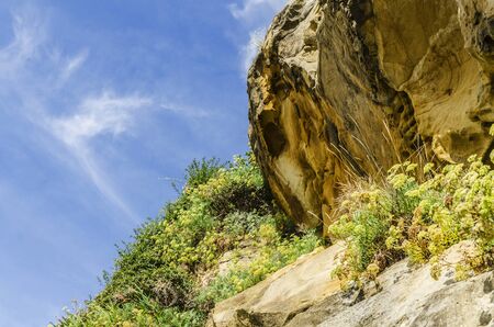 Beautiful yellow rock close to the Atlantic ocean.の写真素材