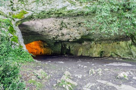 Cave entrance deep in to the forest.の写真素材