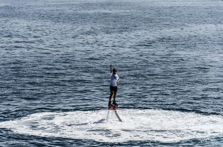 Man with flyboard in the ocean, close to Getaira cityのeditorial素材