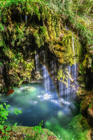 Beautiful waterfall deep into the forest.の写真素材