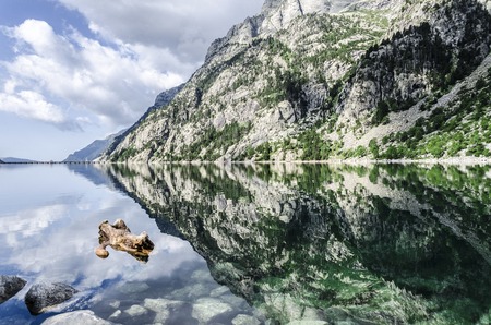 Beautiful river into the Pyrenees mountains, with peaceful water.の写真素材