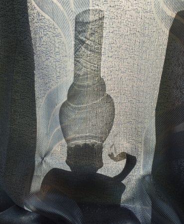 kerosene lamp behind the curtainの写真素材