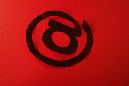 at sign on redの写真素材