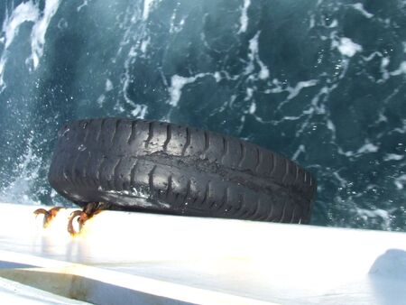 tyre on side of the boatの写真素材
