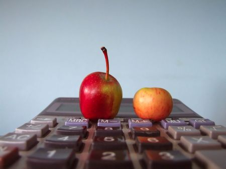 tiny apples on calculatorの写真素材