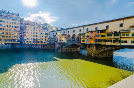 Ponte Vecchio and surrounding buildings on a sunny day in Florence, Tuscanyの写真素材
