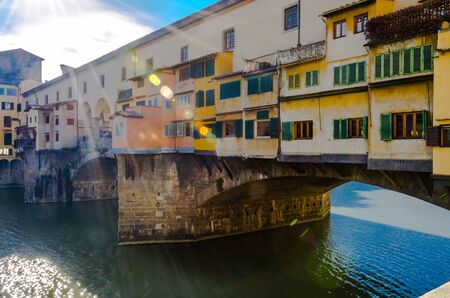 Sunbeams on the historic Ponte Vecchio in Florence, Tuscanyの写真素材