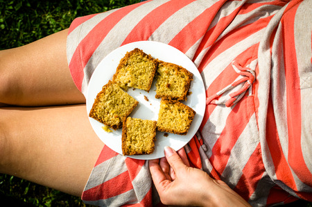 Slices of lemon cake on her a woman's lap