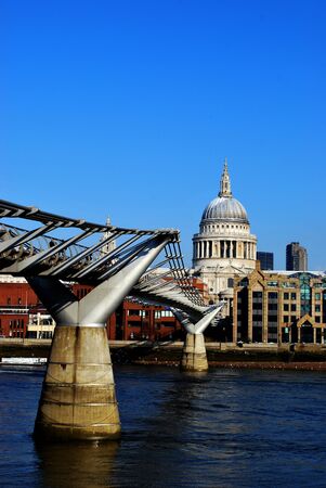 Millennium Bridge over the River Thames in London with St Paul's Cathedralの写真素材