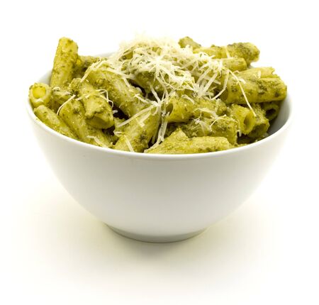 Rigatoni pasta and basil pesto with grated parmesan cheeseの写真素材
