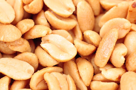 Close-up of a group of salted roasted peanuts