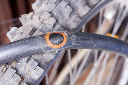 A bicycle innertube with a puncture repair patchの写真素材
