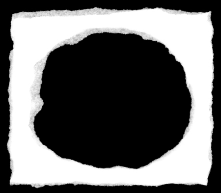 Torn white paper with a ripped hole isolated on a black background showing the fibersの写真素材