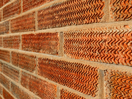  close up of a wall showing the mortar and the texture of the brick                          の写真素材