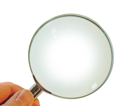  Hand holding a magnifying glass, isolated on a white background                               の写真素材