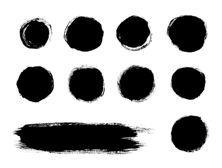 Black painted brush stroke shapes isolated on a white backgroundの写真素材