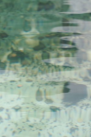 Coins in shallow pool
