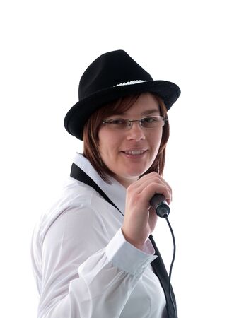 Young woman singing into a microphoneの写真素材
