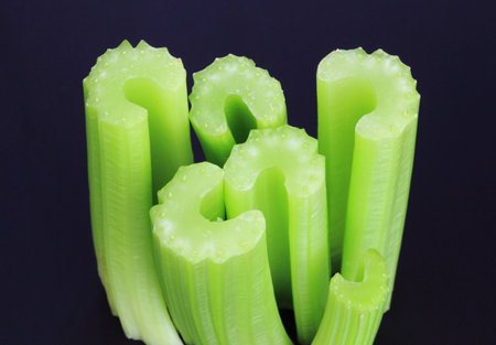 Celery sticks on a black background.の写真素材