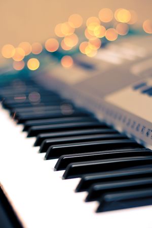 Sparks of light around the keyboard of synthesizerの写真素材